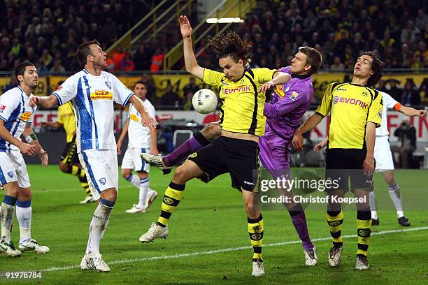 Andreas Luthe of Bochum , Neven Subotic and Mats Hummels of Dortmund battle for the ball during the Bundesliga match between Borussia Dortmund and...