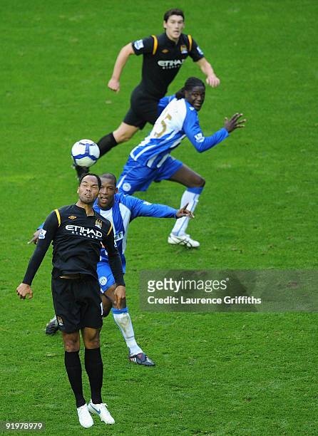 Joleon Lescott of Manchester City flicks the ball on from a set piece during the Barclays Premiership match between Wigan Athletic and Manchester...