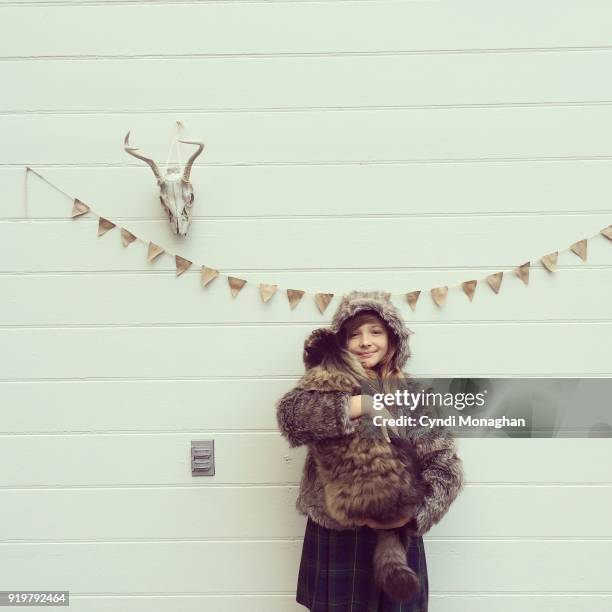 girl holding big cat - bunting white background fotografías e imágenes de stock