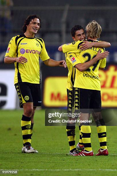 Neven Subotic, Nuri Sahin and Marcel Schmelzer of Dortmund celebrate the 2-0 victory after the Bundesliga match between Borussia Dortmund and VfL...