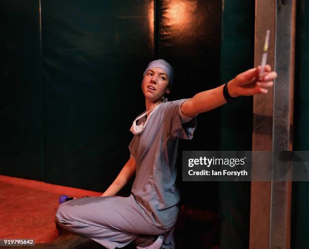 Anesthetist Evie Mountain monitors and assists a horse as it lies in a padded and heated recovery room recovering from general anesthetic following a...