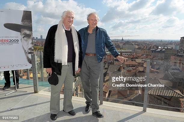 Director Bertrand Tavernier and actor Clint Eastwood pose during the Lumiere Film Festival in Lyon on October 18, 2009 in Lyon, France.