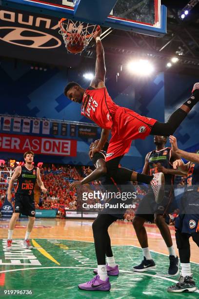 Derek Cooke Jr. Of the Wildcats crashes over Jerry Evans Jr. Of the Taipans during the round 19 NBL match between the Perth Wildcats and the Cairns...