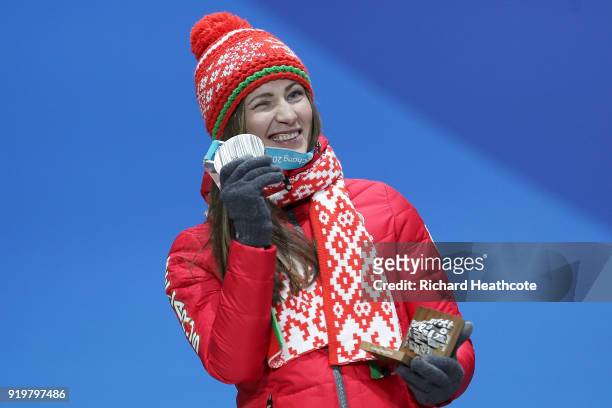 Silver medalist Darya Domracheva of Belarus celebrates during the victory ceremony after the Women's 12.5km Mass Start Biathlon on day nine of the...