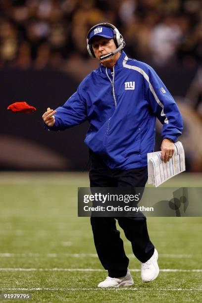 Head coach Tom Coughlin of the New York Giants throws out the red challenge flag during the game against the New Orleans Saints at the Louisiana...