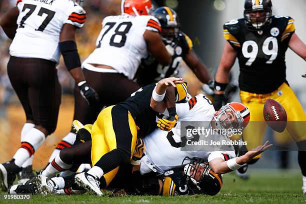 Derek Anderson of the Cleveland Browns fumbles the football after being sacked by James Farrior of the Pittsburgh Steelers at Heinz Field on October...