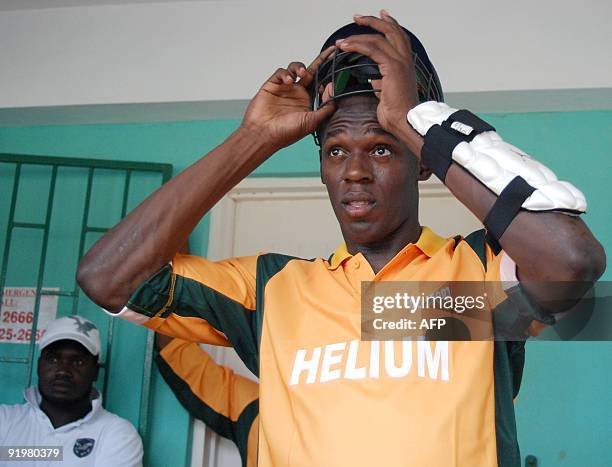 Olympic 100m champion and world record holder Usain Bolt prepares for a charity invitational celebrity cricket match on October 18, 2009 at the...
