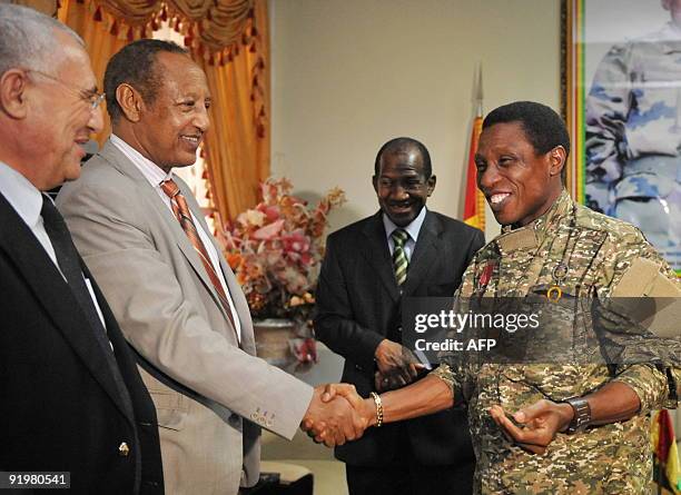 Junta leader Moussa Dadis Camara greets Haile Menkerios , deputy Secretary General to the UN in charge of political affairs near Guinean Prime...