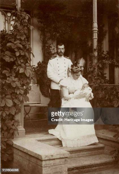 Tsar Nicholas II and Empress Alexandra Fyodorovna with their second daughter, Grand Duchess Tatyana, 1897. Found in the collection of State Archive...