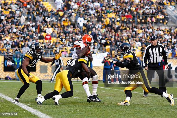 Ike Taylor of the Pittsburgh Steelers tackles Mohamed Massaquoi of the Cleveland Browns just short of the goal line at Heinz Field on October 18,...