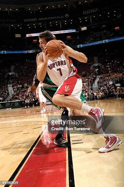 Andrea Bargnani of the Toronto Raptors drives strong along the basline during a game against the Boston Celtics on October 18, 2009 at the Air Canada...