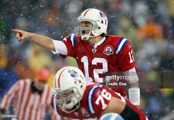 Quarterback Tom Brady of the New England Patriots calls out the play as Sebastian Vollmer listens in the first quarter against the Tennessee Titans...