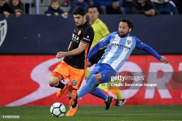 Goncalo Guedes of Valencia CF, Manuel Iturra of Malaga CF during the La Liga Santander match between Malaga v Valencia at the Estadio La Rosaleda on...