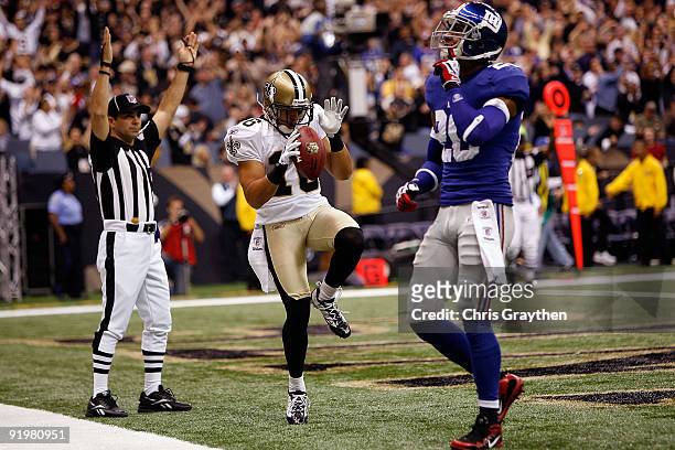 Lance Moore of the New Orleans Saints celebrates after scoring a touchdown against the New York Giants at the Louisiana Superdome on October 18, 2009...