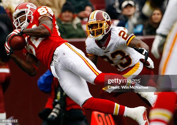 Dwayne Bowe of the Kansas City Chiefs catches a pass as DeAngelo Hall of the Washington Redskins defends during their game October 18, 2009 at FedEx...