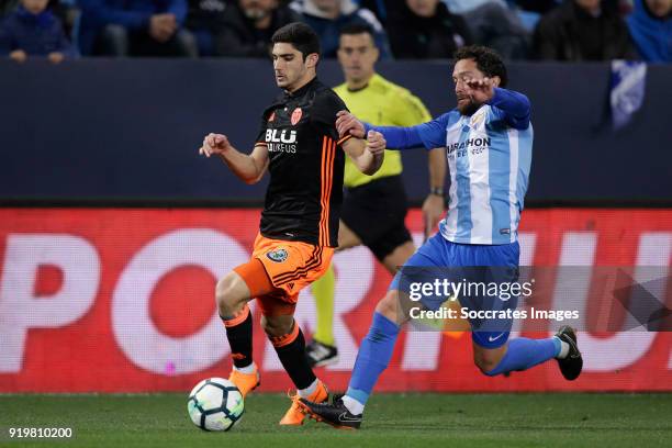 Goncalo Guedes of Valencia CF, Manuel Iturra of Malaga CF during the La Liga Santander match between Malaga v Valencia at the Estadio La Rosaleda on...