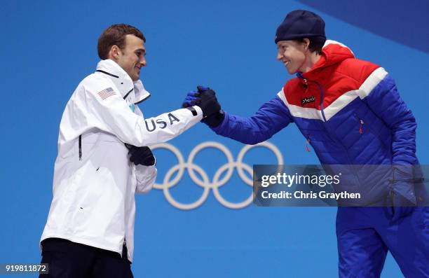 Silver medalist Nick Goepper of the United States and gold medalist Oystein Braaten of Norway celebrate during the medal ceremony for the Freestyle...