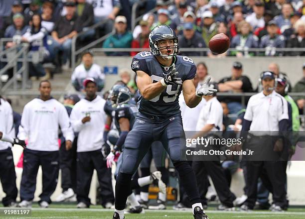 Tight end John Carlson of the Seattle Seahawks makes a catch on a fake punt against the Arizona Cardinals on October 18, 2009 at Qwest Field in...