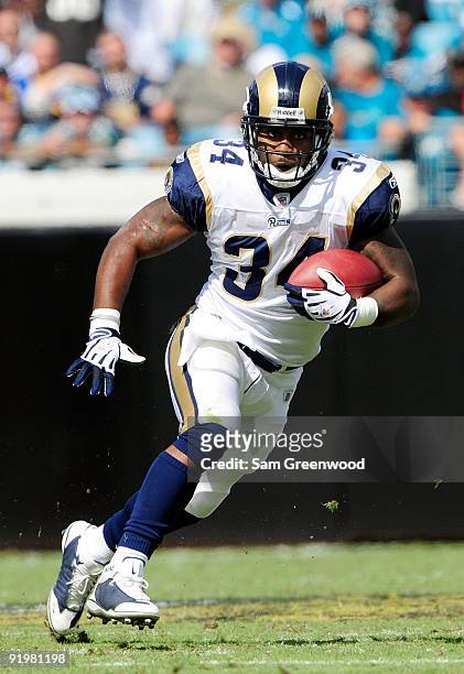Kenneth Darby of the St. Louis Rams runs for yardage against the Jacksonville Jaguars at Jacksonville Municipal Stadium on October 18, 2009 in...