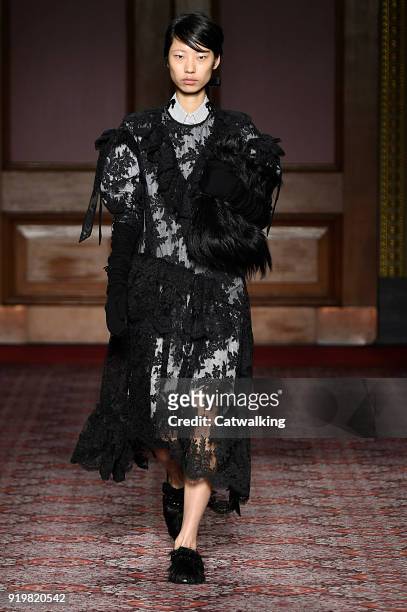 Model walks the runway at the Simone Rocha Autumn Winter 2018 fashion show during London Fashion Week on February 17, 2018 in London, United Kingdom.