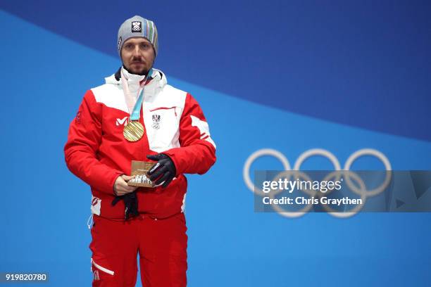 Gold medalist Marcel Hirscher of Austria stands during the medal ceremony for the Alpine Skiing Men's Giant Slalom on day nine of the PyeongChang...