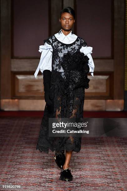Model walks the runway at the Simone Rocha Autumn Winter 2018 fashion show during London Fashion Week on February 17, 2018 in London, United Kingdom.