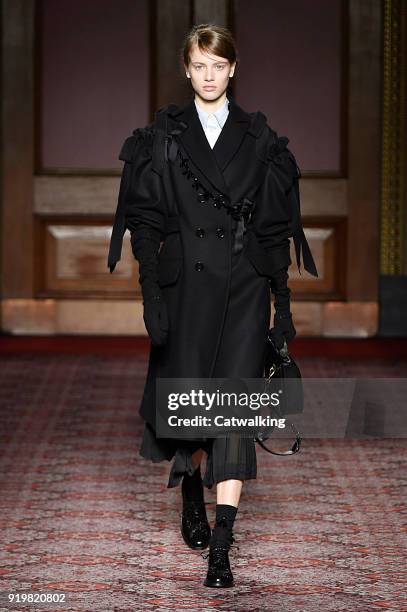 Model walks the runway at the Simone Rocha Autumn Winter 2018 fashion show during London Fashion Week on February 17, 2018 in London, United Kingdom.