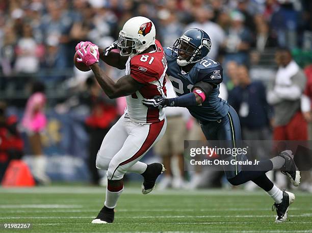 Wide receiver Anquan Boldin of the Arizona Cardinals makes a catch against Kelly Jennings of the Seattle Seahawks on October 18, 2009 at Qwest Field...