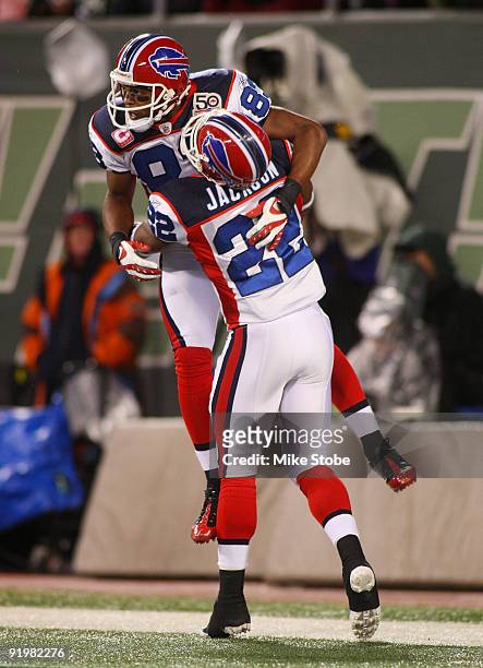 Lee Evans of the Buffalo Bills celebrates with teammate Fred Jackson after catching a touchdown pass in the third quarter against the New York Jets...