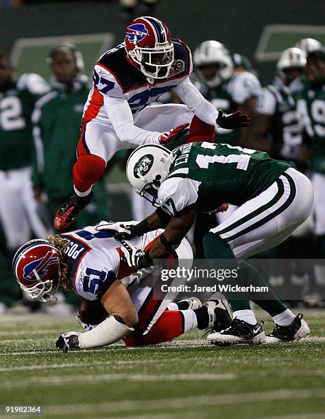 Paul Posluszny of the Buffalo Bills catches an interception in front of Braylon Edwards of the New York Jets that led to the game winning field goal...