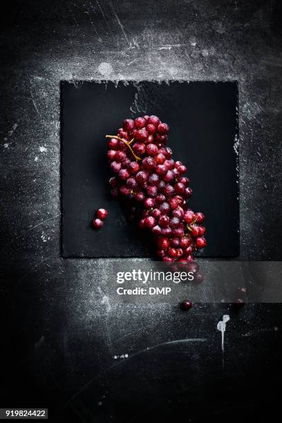 bunch of red grapes - red grapes stock pictures, royalty-free photos & images