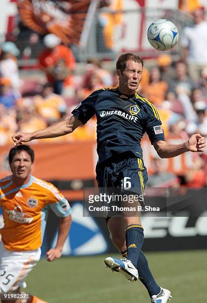 Brian Ching of the Houston Dynamo defends Gregg Berhalter of the Los Angeles Galaxy at Robertson Stadium on October 18, 2009 in Houston, Texas.