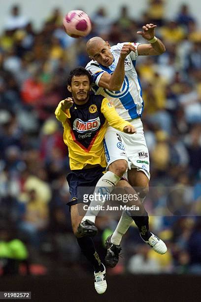 Daniel Marquez of America vies for the ball with Alejandro Acosta of Puebla during their match in the 2009 Opening tournament, the closing stage of...