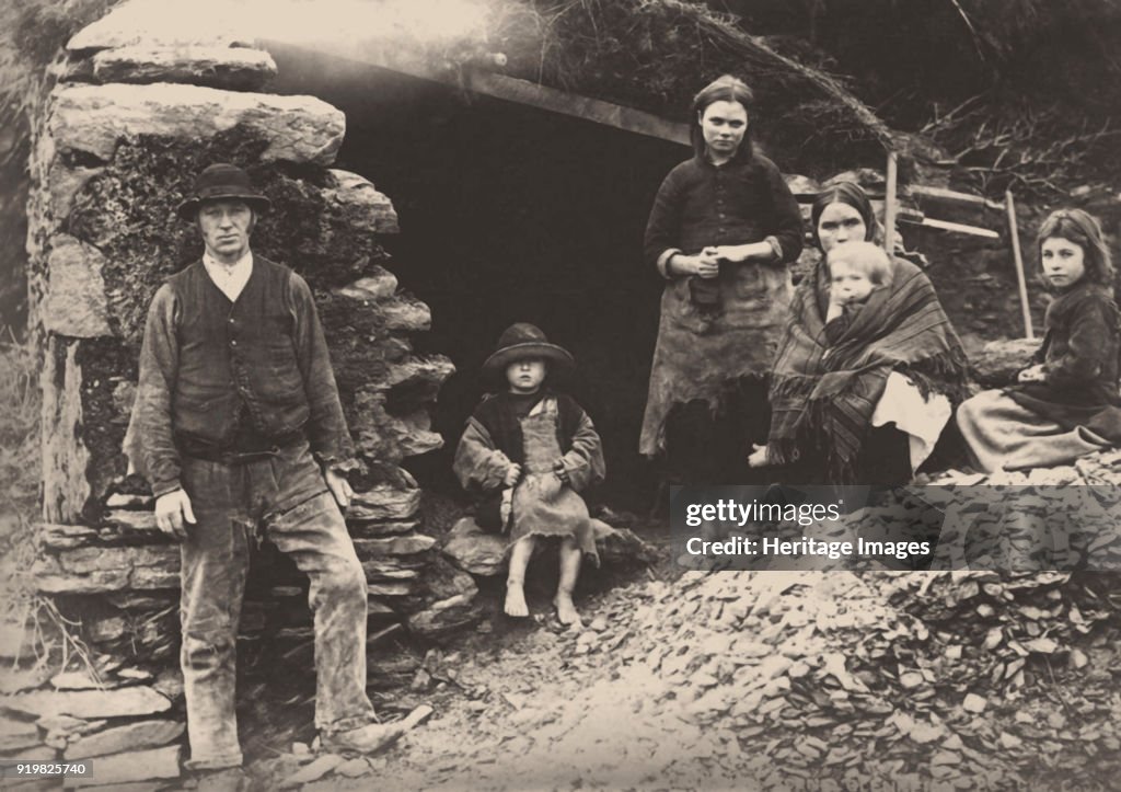 The Great Famine. A Family At The Ruins Of Their House In Killarney