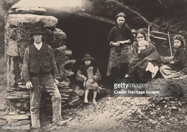 The Great Famine. A family at the ruins of their house in Killarney, 1888. Private Collection.