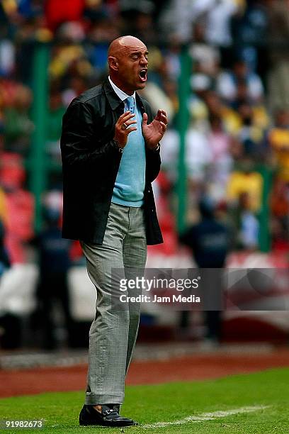 Puebla's head coach Jose Luis Sanchez reacts during their match in the 2009 Opening tournament, the closing stage of the Mexican Football League, at...