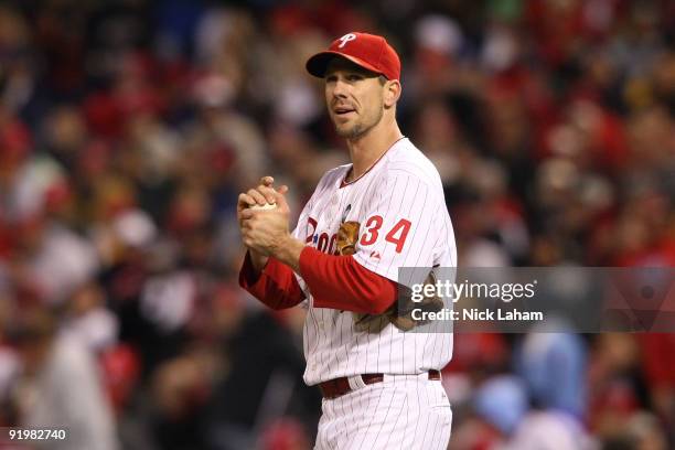 Cliff Lee of the Philadelphia Phillies rubs the ball down against the Los Angeles Dodgers during Game Three of the NLCS during the 2009 MLB Playoffs...