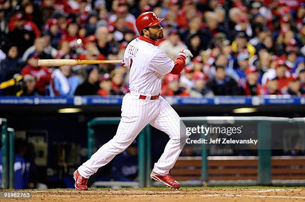 Pedro Feliz of the Philadelphia Phillies connects for a triple in the fifth inning against the Los Angeles Dodgers in Game Three of the NLCS during...