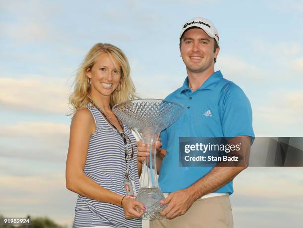 Martin Laird of Scoltand with his girlfriend Meagan holds the winner trophy during the final round of the Justin Timberlake Shriners Hospitals for...