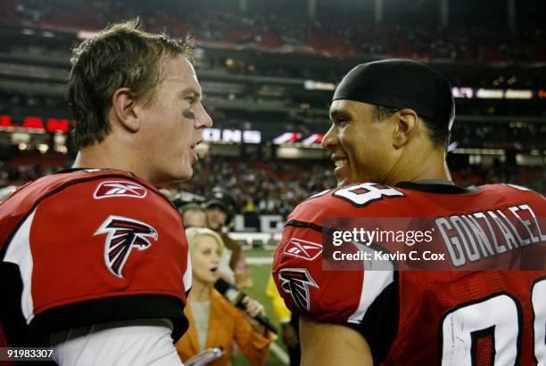 Quarterback Matt Ryan of the Atlanta Falcons speaks to teammate Tony Gonzalez after their 21-14 victory in the game against the Chicago Bears at the...
