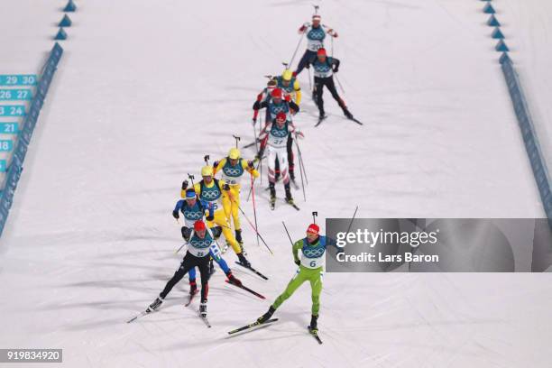 Benedikt Doll of Germany and Jakov Fak of Slovenia compete during the Men's 15km Mass Start Biathlon on day nine of the PyeongChang 2018 Winter...