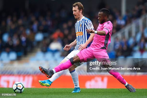 David Zurutuza of Real Sociedad competes for the ball with Cheik Doukoure of Levante UD during the La Liga match between Real Sociedad and Levante at...