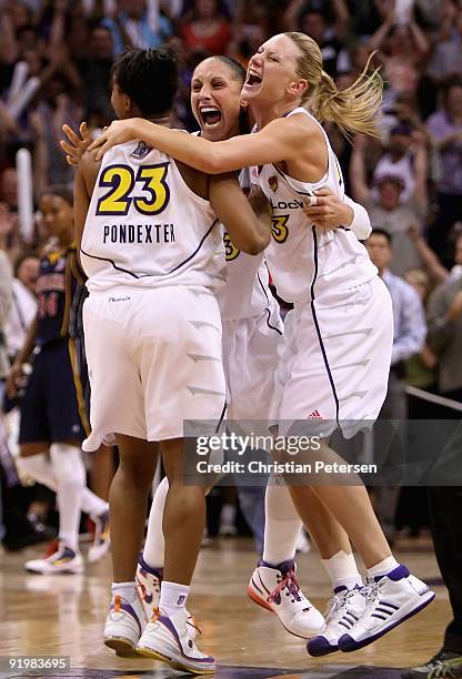 Cappie Pondexter, Diana Taurasi and Penny Taylor of the Phoenix Mercury celebrate after defeating the Indiana Fever in Game Five of the 2009 WNBA...