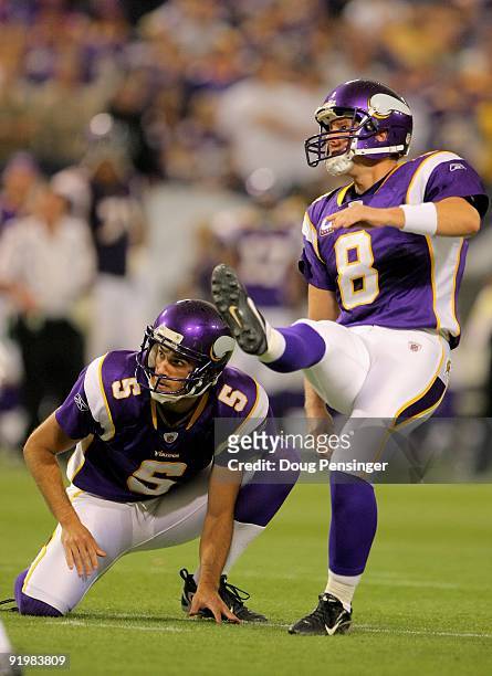 Place kicker Ryan Longwell of the Minnesota Vikings kicks a field goal from the hold of Chris Kluwe against the Baltimore Ravens during NFL action at...