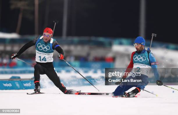 Martin Fourcade of France narrowly wins the gold medal from silver medallist Simon Schempp of Germany during the Men's 15km Mass Start Biathlon on...