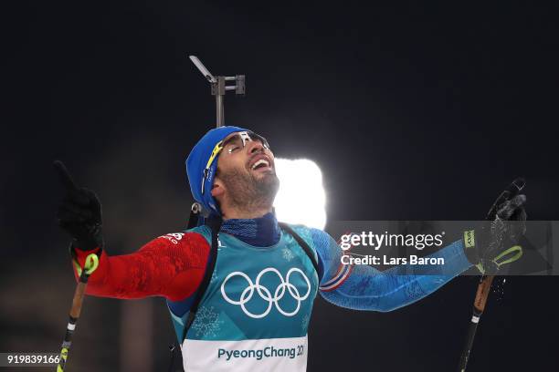 Martin Fourcade of France celebrates winning the gold medal during the Men's 15km Mass Start Biathlon on day nine of the PyeongChang 2018 Winter...