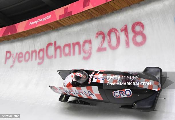 Croatia's Drazen Silic and Croatia's Benedikt Nikpalj compete in the 2-man bobsleigh heat 1 run during the Pyeongchang 2018 Winter Olympic Games, at...