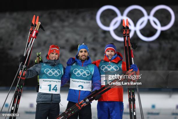 Gold medallist Martin Fourcade of France poses with silver medallist Simon Schempp of Germany and bronze medallist Emil Hegle Svendsen of Norway...