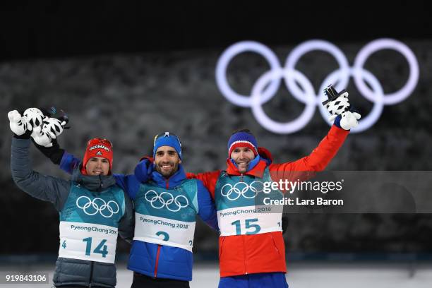 Gold medallist Martin Fourcade of France poses with silver medallist Simon Schempp of Germany and bronze medallist Emil Hegle Svendsen of Norway...