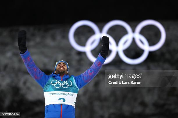 Gold medallist Martin Fourcade of France celebrates during the victory ceremony for the Men's 15km Mass Start Biathlon on day nine of the PyeongChang...